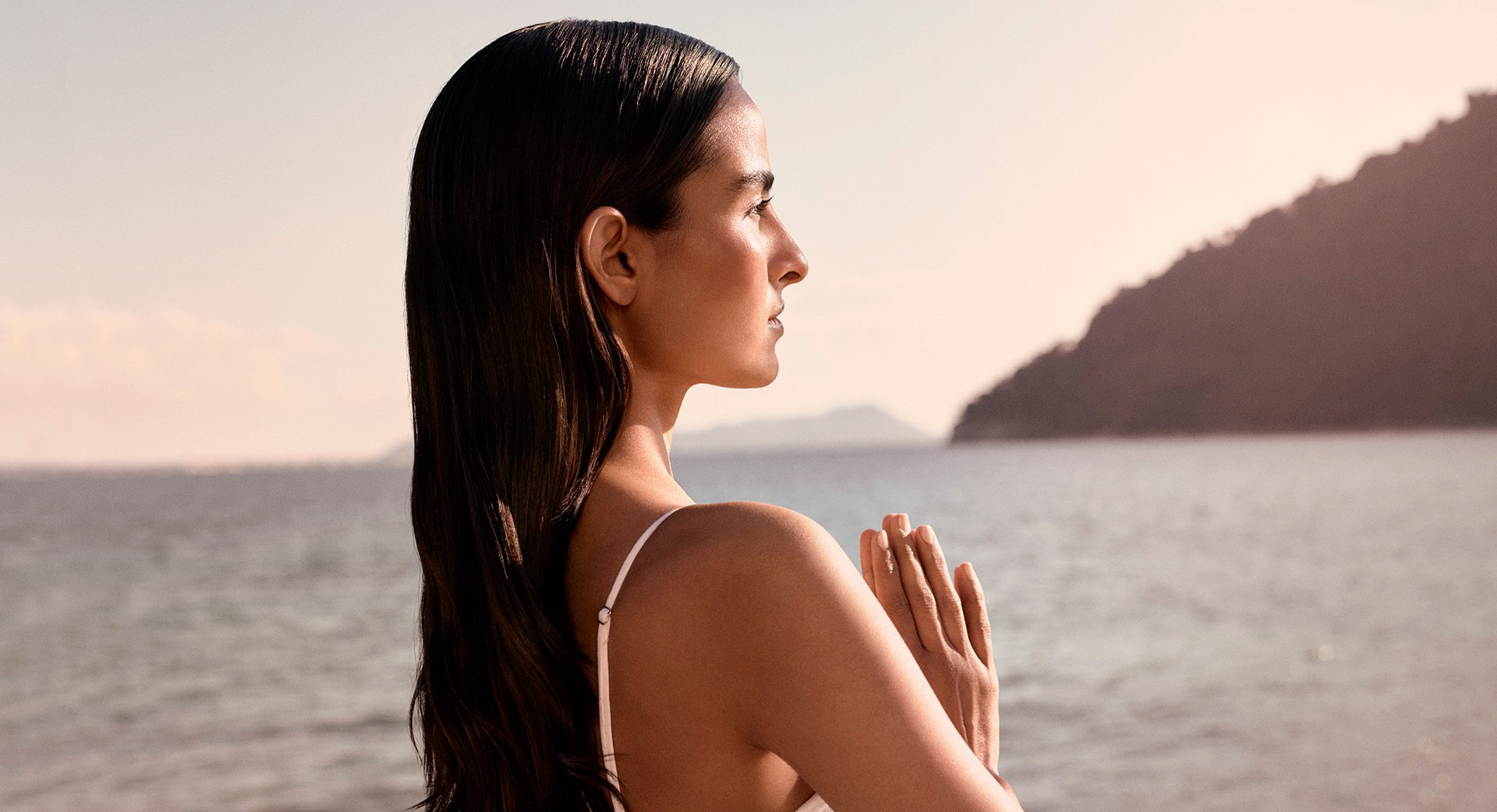 Image of model in prayer pose