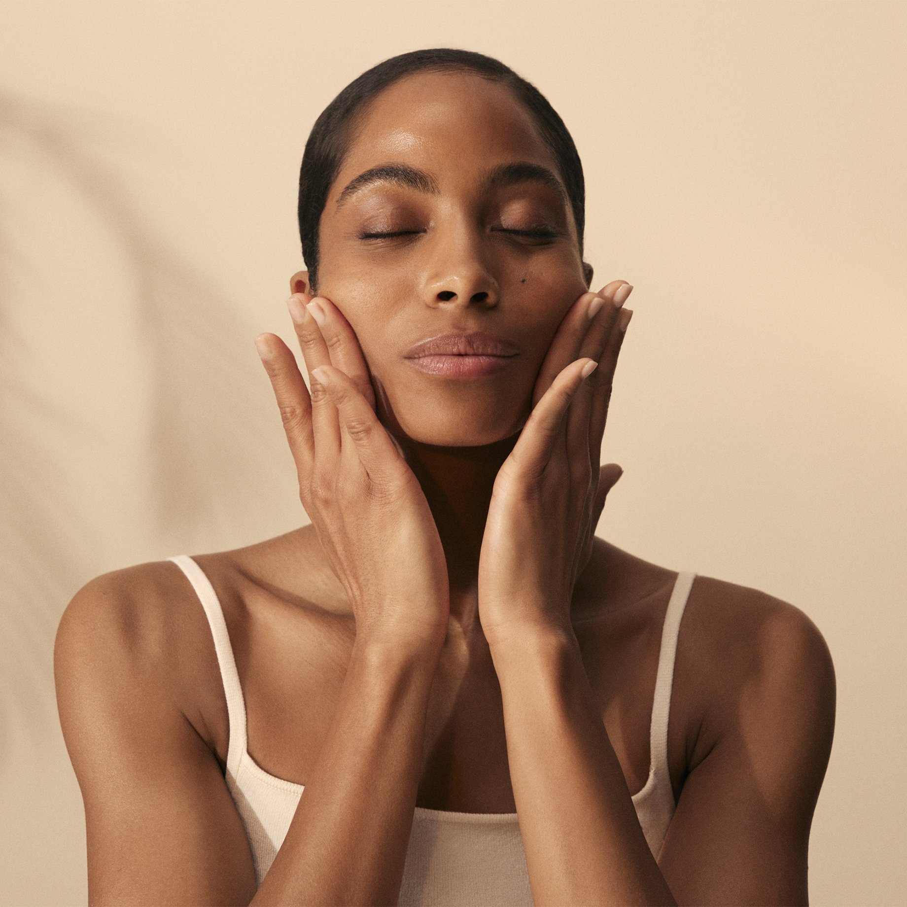 Image of women massaging her face after applying Kumkumadi Moisturiser