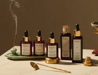 image of five totemic oils on a table with incense burning