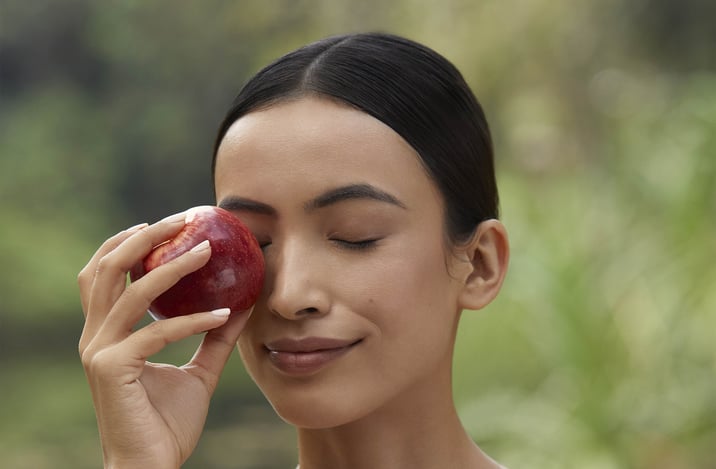 model holding an apple.jpg