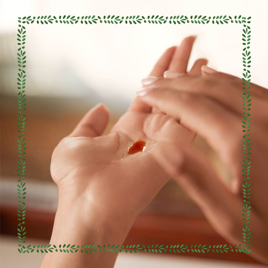 Image of Kumkumadi Oil in palm of hand